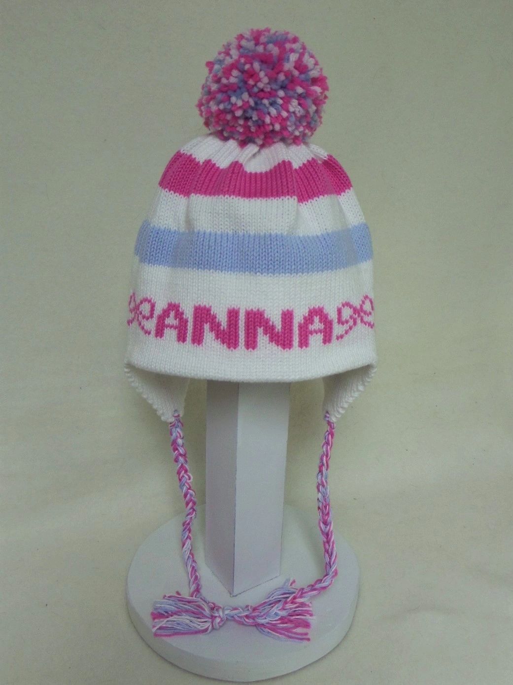 STRIPE EARFLAP WITH NAME BOWS AND POMPOM